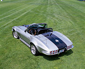 VET 03 RK0395 02
1965 Chevrolet Corvette ZR1 Convertible Silver With Black Stripe Overhead 3/4 Rear View On Grass