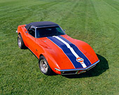 VET 03 RK0400 03
1969 Corvette ZL1 Roadster Orange Blue And White Stripe Overhead 3/4 Front View On Grass
