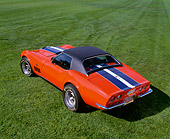 VET 03 RK0401 06
1969 Chevrolet Corvette ZL1 Roadster Orange With Blue And White Stripe Overhead 3/4 Rear View On Grass