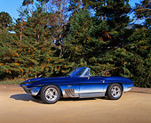 VET 03 RK0402 03
1964 Chevrolet Corvette Stingray Convertible Shark I Blue 3/4 Side View On Sand By Trees