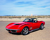 VET 03 RK0441 03
1969 Chevrolet Corvette Convertible Red Black Stripes 3/4 Front View On Pavement