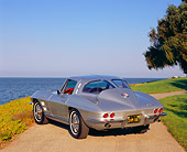 VET 03 RK0455 04
1963 Chevy Corvette Split Window Silver 3/4 Rear View On Pavement By Water