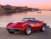 VET 03 RK0539 01
1969 Chevrolet Corvette Stingray Convertible Red 3/4 Front View On Pavement By Canal And Homes