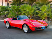 VET 03 RK0540 01
1969 Chevrolet Corvette Stingray Convertible Red 3/4 Front View On Pavement By Palm Trees