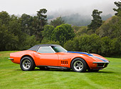 VET 03 RK0560 01
1969 Chevrolet Corvette ZL1 Roadster Orange With Blue And White Stripe 3/4 Front View On Lawn
