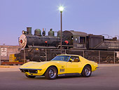 VET 03 RK0583 01
1969 Chevrolet Corvette Coupe Yellow 3/4 Front View On Pavement By Train