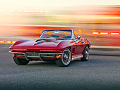 VET 03 RK0593 01
1967 Chevrolet Corvette Convertible Maroon 3/4 Front View On Pavement By Fire Trucks In Motion