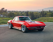 VET 03 RK0633 01
1967 Chevrolet Corvette Red With Silver Stripe 3/4 Front View On Pavement By Hills