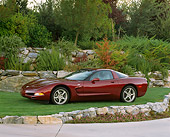 VET 04 RK0038 02
2003 Chevrolet Corvette 50th Anniversary Edition Burgundy Side 3/4 View On Grass By Trees And Bushes