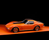 VET 05 RK0135 05
1971 Chevrolet Corvette Stingray Orange Bullstripe Overhead 3/4 Side View On Orange Floor Studio