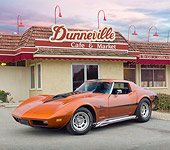 VET 05 RK0219 01
1974 Chevrolet Corvette Sunburst Yellow 3/4 Front View On Pavement By Cafe