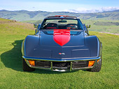 VET 05 RK0236 01
1972 Chevrolet Corvette Silver And Red Front View On Grass By Hills