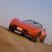 VET 05 RK0048 31
1974 Chevrolet Corvette Stingray Orange Slanted 3/4 Front View On Pavement Hill