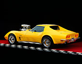 VET 05 RK0112 05
1973 Chevrolet Corvette Modified Yellow 3/4 Rear View On Red Floor Studio