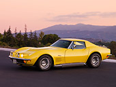 VET 05 RK0147 01
1972 Chevrolet Corvette Coupe Yellow 3/4 Front View On Pavement By Trees Mountain