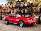 VET 05 RK0158 01
1977 Chevrolet Corvette Coupe Red 3/4 Front View On Gravel By Wine Barrels