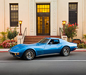 VET 05 RK0185 01
1971 Chevrolet Corvette Stingray Blue 3/4 Front View On Pavement By Building