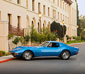 VET 05 RK0186 01
1971 Chevrolet Corvette Stingray Blue 3/4 Front View On Pavement By Building