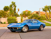VET 05 RK0189 01
1971 Chevrolet Corvette Stingray Blue 3/4 Front View On Pavement By Building And Palm Trees