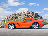VIP 01 RK0314 01
2010 Dodge Viper SRT/10 Coupe Orange With Black Stripe Profile View On Gravel By Rocky Hill