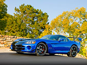 VIP 01 RK0324 01
2010 Dodge Viper ACR Blue With Black Stripe 3/4 Front View On Pavement By Stone Wall And Trees