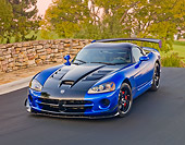 VIP 01 RK0325 01
2010 Dodge Viper ACR Blue With Black Stripe 3/4 Front View On Pavement By Stone Wall And Trees