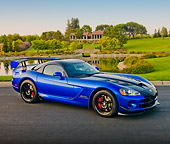 VIP 01 RK0328 01
2010 Dodge Viper ACR Blue With Black Stripe 3/4 Front View On Pavement By Pond And Trees