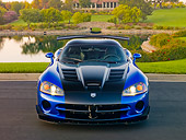 VIP 01 RK0330 01
2010 Dodge Viper ACR Blue With Black Stripe Front View On Pavement By Pond And Trees