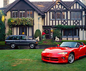 VIP 01 RK0076 36
1994 Red Dodge Viper On Grass In Front Of House With Range Rover In Driveway