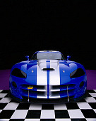 VIP 01 RK0197 20
2003 Dodge Viper Competition Coupe Blue Silver Stripe Wide Angle Head On Purple Checkered