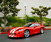 VIP 01 RK0215 01
2002 Dodge Viper Red With White Stripes 3/4 Front View On Pavement By Bushes And Trees