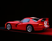 VIP 02 RK0060 02
1997 Dodge Hennessey Viper Venom 600 GTS Red White Stripes 3/4 Rear View On Red Floor Studio