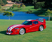 VIP 02 RK0076 06
1997 Dodge Hennessey Viper Venom 600 GTS Red White Stripes 3/4 Side View On Grass By Water