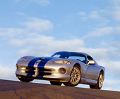 VIP 02 RK0101 06
1999 Dodge Viper GTS ACR Silver Blue Stripe Low 3/4 Front View On Pavement Hill Blue Sky