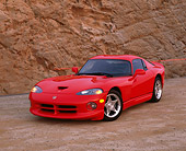 VIP 02 RK0152 04
1997 Dodge Viper GTS Coupe Red 3/4 Front View On Sand Against Rock