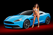 WMN 03 BK0001 01
2013 Aston Martin Vanquish Blue 3/4 Front View In Studio With Swimsuit Model