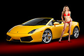 WMN 03 BK0002 01
2012 Lamborghini Gallardo LP 550-2 Spyder  Yellow 3/4 Front View In Studio With Swimsuit Model