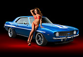 WMN 03 RK0306 01
1969 Chevrolet Yenko Camaro Lemans Blue 3/4 Front View In Studio With Swimsuit Model