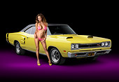 WMN 03 RK0310 01
1969 Dodge Coronet R/T Yellow 3/4 Front View In Studio With Swimsuit Model