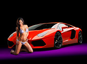 WMN 03 RK0322 01
2012 Lamborghini Aventador Tangerine 3/4 Front View In Studio With Swimsuit Model