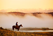WRG 01 RK0218 02
Profile Of Wrangler On Horse Standing By Lake With Morning Fog